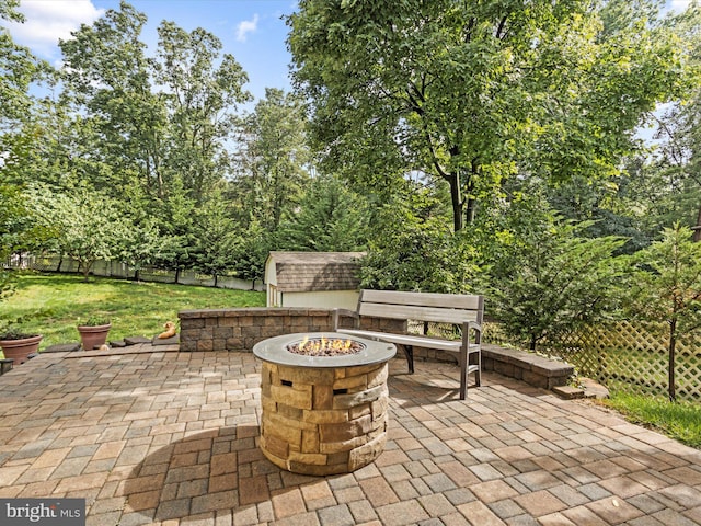 1505 Ridge Forest Way, Hanover, MD 21076 - fenced backyard featuring a fire pit, a patio, and a shed