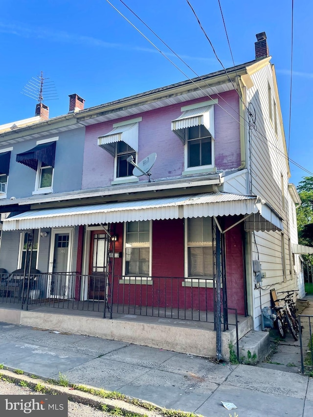 363 New St, Pottstown, PA 19464 - view of front facade with a porch and a chimney
