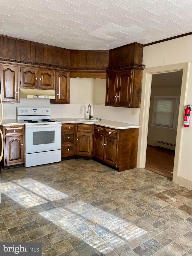 363 New St, Pottstown, PA 19464 - kitchen featuring white electric range, under cabinet range hood, baseboard heating, and light countertops