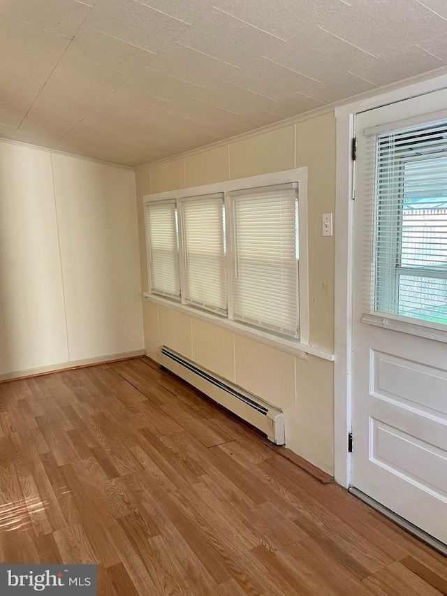 363 New St, Pottstown, PA 19464 - unfurnished room with baseboard heating and light wood-style flooring