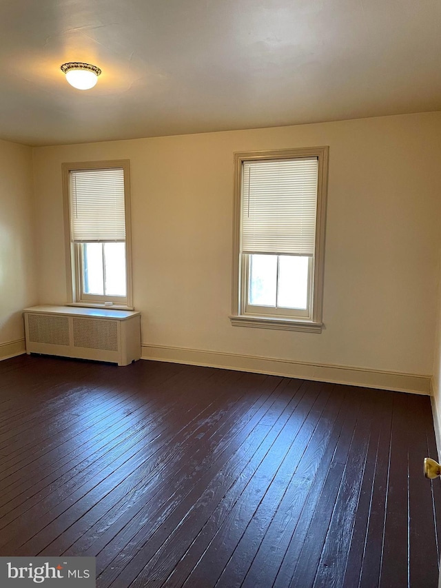 363 New St, Pottstown, PA 19464 - empty room featuring radiator and dark wood-style floors