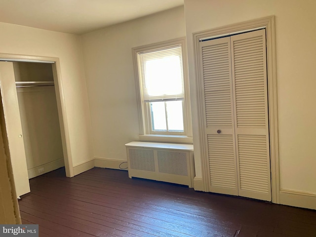 363 New St, Pottstown, PA 19464 - unfurnished bedroom featuring radiator and dark wood-type flooring
