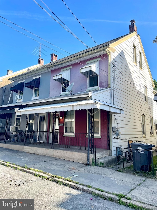 363 New St, Pottstown, PA 19464 - view of front of house featuring a chimney and covered porch