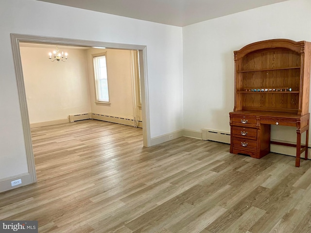 363 New St, Pottstown, PA 19464 - empty room featuring a baseboard radiator, a chandelier, and light wood finished floors