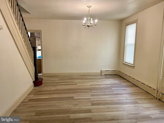 363 New St, Pottstown, PA 19464 - empty room with a chandelier and wood finished floors