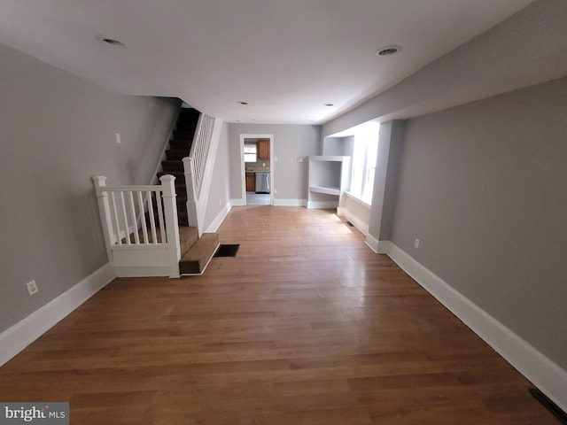 666 Manatawny St, Pottstown, PA 19464 - corridor featuring stairs and light wood-style flooring