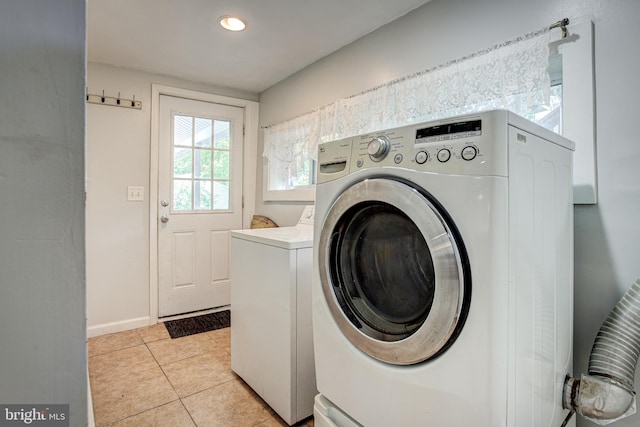 328 E Logan St, Bellefonte, PA 16823 - washroom with separate washer and dryer and light tile patterned flooring