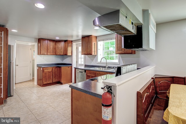 328 E Logan St, Bellefonte, PA 16823 - kitchen with brown cabinets, stainless steel appliances, a peninsula, recessed lighting, and light tile patterned floors