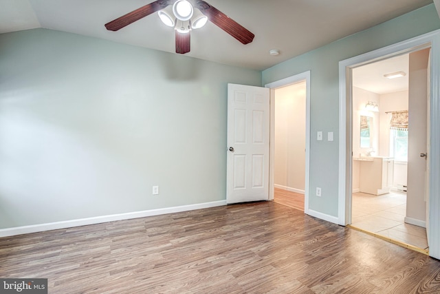 328 E Logan St, Bellefonte, PA 16823 - unfurnished bedroom featuring wood finished floors, a ceiling fan, and lofted ceiling