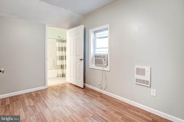 328 E Logan St, Bellefonte, PA 16823 - unfurnished room with heating unit, lofted ceiling, light wood-type flooring, and cooling unit