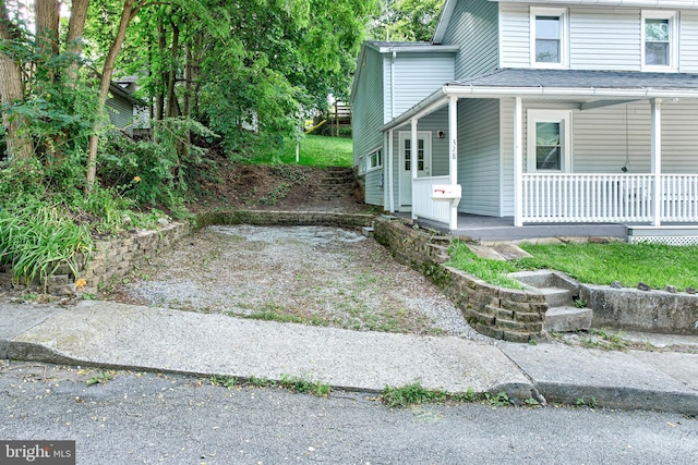 328 E Logan St, Bellefonte, PA 16823 - view of side of home featuring covered porch