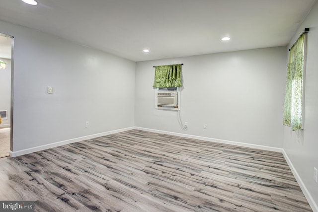 328 E Logan St, Bellefonte, PA 16823 - unfurnished room with recessed lighting, wood finished floors, and cooling unit