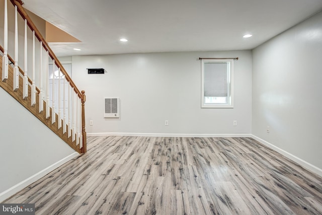 328 E Logan St, Bellefonte, PA 16823 - unfurnished living room featuring wood finished floors, stairs, recessed lighting, and heating unit