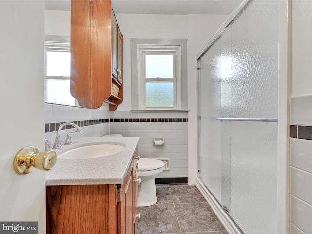 1402 Springside Dr, Lancaster, PA 17603 - bathroom with vanity, a stall shower, healthy amount of natural light, and tile walls