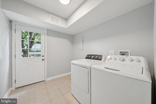 11704 Milbern Dr, Potomac, MD 20854 - washroom featuring independent washer and dryer, light tile patterned floors, and electric panel