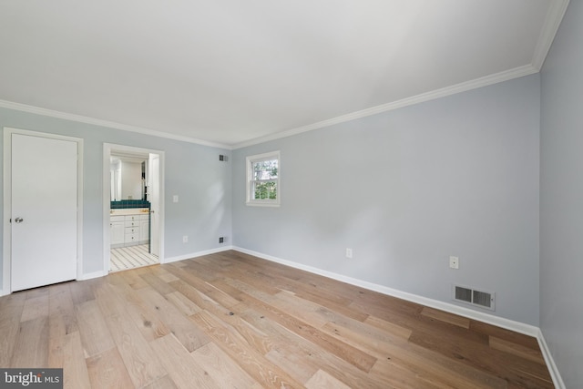 11704 Milbern Dr, Potomac, MD 20854 - unfurnished bedroom with ornamental molding, light wood-type flooring, and ensuite bath