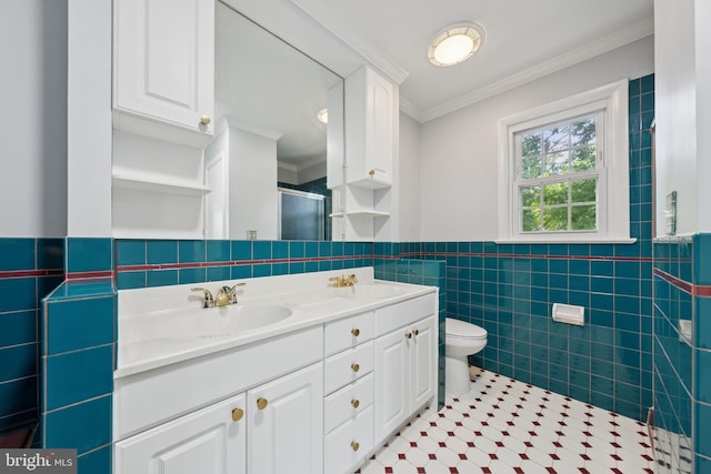 11704 Milbern Dr, Potomac, MD 20854 - bathroom featuring tile walls, crown molding, a stall shower, double vanity, and tile patterned flooring