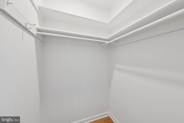 11704 Milbern Dr, Potomac, MD 20854 - walk in closet with wood finished floors