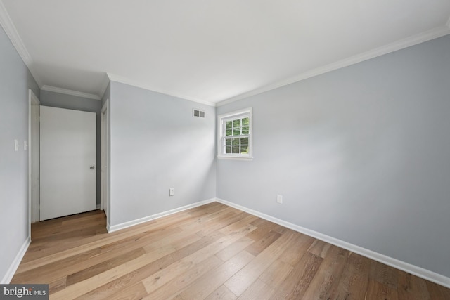 11704 Milbern Dr, Potomac, MD 20854 - unfurnished bedroom featuring light wood-style floors and crown molding