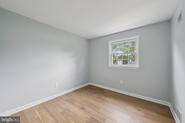 11704 Milbern Dr, Potomac, MD 20854 - empty room with light wood finished floors and baseboards
