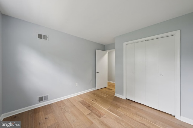 11704 Milbern Dr, Potomac, MD 20854 - unfurnished bedroom featuring light wood finished floors and a closet