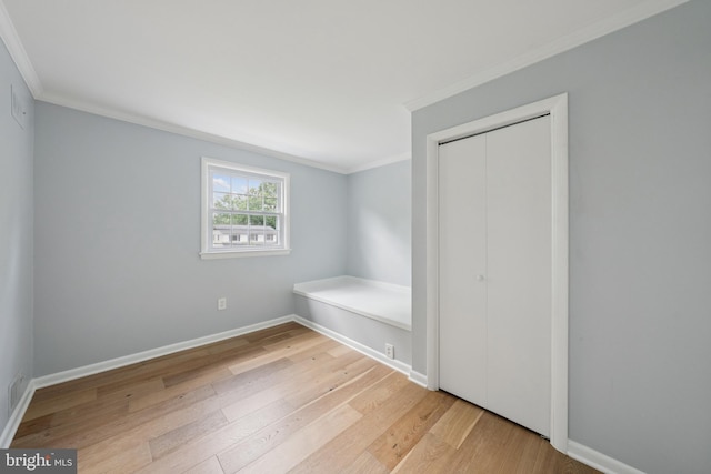 11704 Milbern Dr, Potomac, MD 20854 - unfurnished bedroom featuring ornamental molding, wood finished floors, and a closet