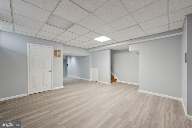 11704 Milbern Dr, Potomac, MD 20854 - finished below grade area with wood finished floors, a paneled ceiling, and stairs