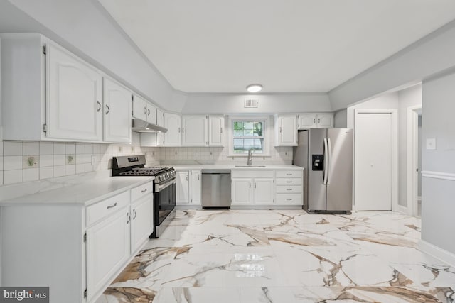 11704 Milbern Dr, Potomac, MD 20854 - kitchen featuring stainless steel appliances, under cabinet range hood, backsplash, white cabinetry, and light countertops