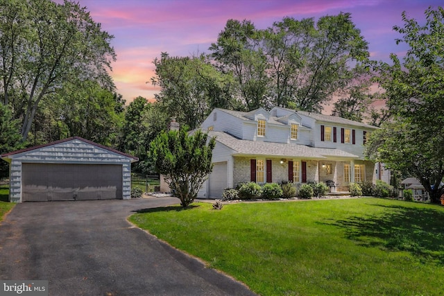 441 Barker Dr, West Chester, PA 19380 - view of front of home with a detached garage, a front yard, covered porch, and brick siding