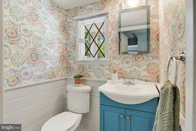 441 Barker Dr, West Chester, PA 19380 - half bathroom featuring wallpapered walls, vanity, and a wainscoted wall
