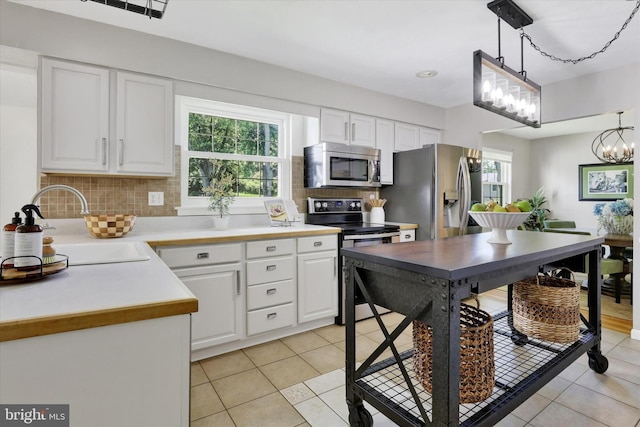 441 Barker Dr, West Chester, PA 19380 - kitchen with appliances with stainless steel finishes, decorative backsplash, white cabinetry, and recessed lighting