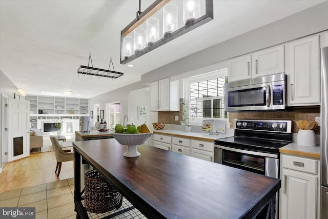441 Barker Dr, West Chester, PA 19380 - kitchen featuring stainless steel appliances, white cabinets, and light tile patterned floors