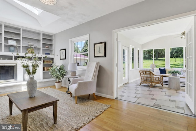 441 Barker Dr, West Chester, PA 19380 - living area featuring lofted ceiling, a skylight, wood finished floors, and built in features