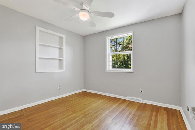 441 Barker Dr, West Chester, PA 19380 - unfurnished room featuring light wood-type flooring, built in shelves, and ceiling fan