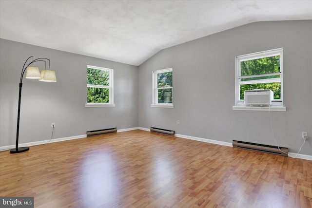 441 Barker Dr, West Chester, PA 19380 - spare room featuring a baseboard heating unit, vaulted ceiling, wood finished floors, and cooling unit