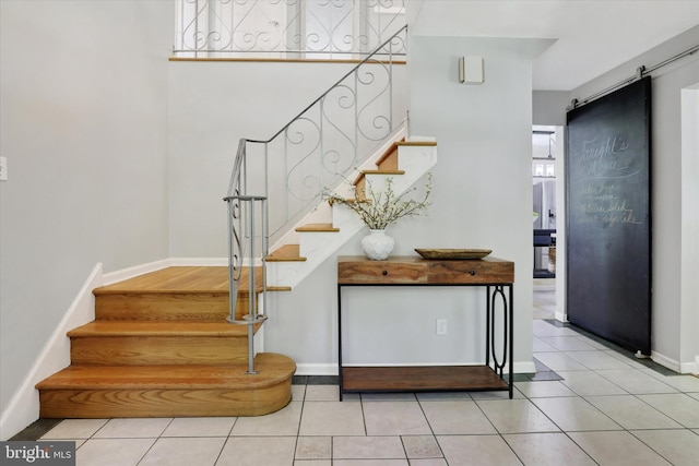 441 Barker Dr, West Chester, PA 19380 - stairs featuring a barn door and tile patterned floors