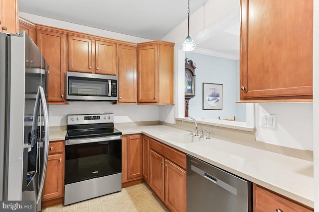 7000 Village Way Unit 408, Boothwyn, PA 19061 - kitchen with stainless steel appliances, light countertops, decorative light fixtures, brown cabinets, and ornamental molding