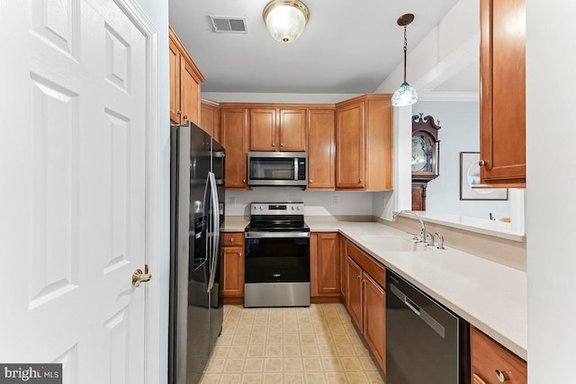 7000 Village Way Unit 408, Boothwyn, PA 19061 - kitchen featuring appliances with stainless steel finishes, light countertops, brown cabinets, and hanging light fixtures