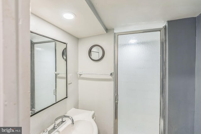 8305 Navahoe Dr, Silver Spring, MD 20903 - bathroom featuring a sink and a shower with shower door