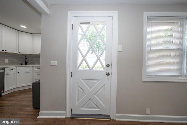 10 Holbrook Rd, Havertown, PA 19083 - doorway to outside with baseboards and dark wood-style flooring