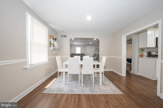 10 Holbrook Rd, Havertown, PA 19083 - dining area featuring arched walkways, dark wood finished floors, plenty of natural light, and recessed lighting