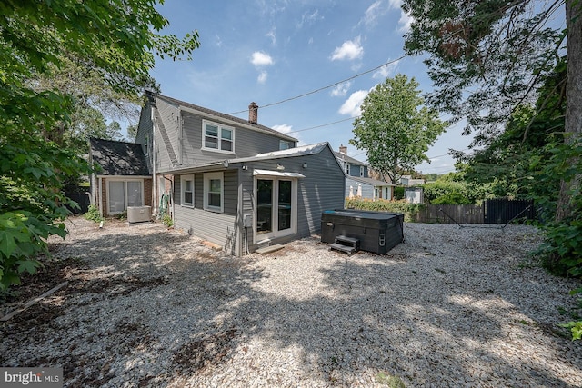 10 Holbrook Rd, Havertown, PA 19083 - back of house with a hot tub and a chimney