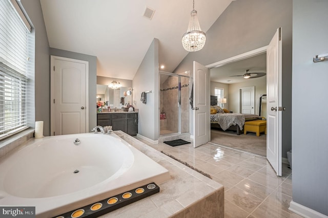 216 Shapley Dr, Smyrna, DE 19977 - ensuite bathroom with lofted ceiling, a stall shower, a garden tub, plenty of natural light, and vanity