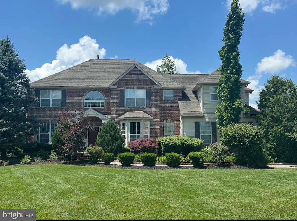 208 Hickory Ln, Mullica Hill, NJ 08062 - view of front of house featuring a front lawn and brick siding