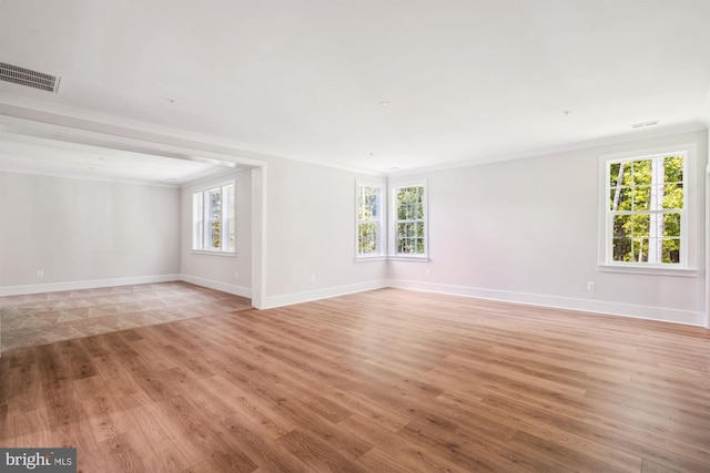 3904 Diplomat Ave, Bowie, MD 20721 - empty room featuring light wood-type flooring, ornamental molding, and plenty of natural light