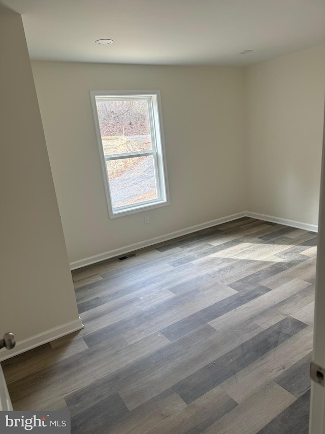 327 Red Bird Ln, Harpers Ferry, WV 25425 - unfurnished room with dark wood-style flooring and recessed lighting