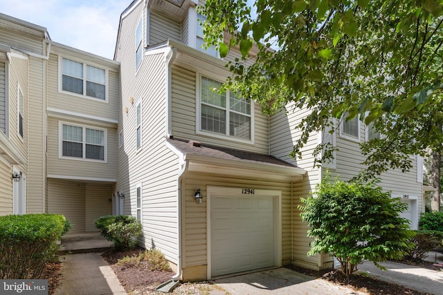 12941 Bridger Dr Unit 1611, Germantown, MD 20874 - view of property with a garage and driveway