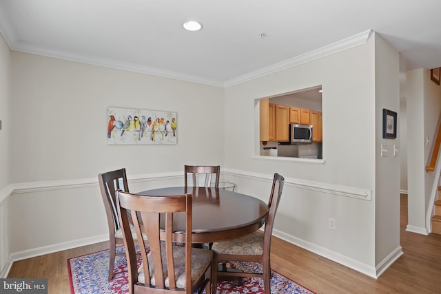 12941 Bridger Dr Unit 1611, Germantown, MD 20874 - dining space with wood finished floors, crown molding, recessed lighting, and stairway