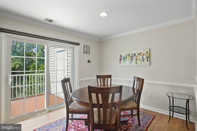 12941 Bridger Dr Unit 1611, Germantown, MD 20874 - dining room featuring light wood finished floors and crown molding