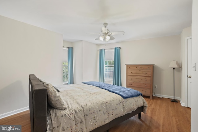 12941 Bridger Dr Unit 1611, Germantown, MD 20874 - bedroom with wood finished floors and a ceiling fan